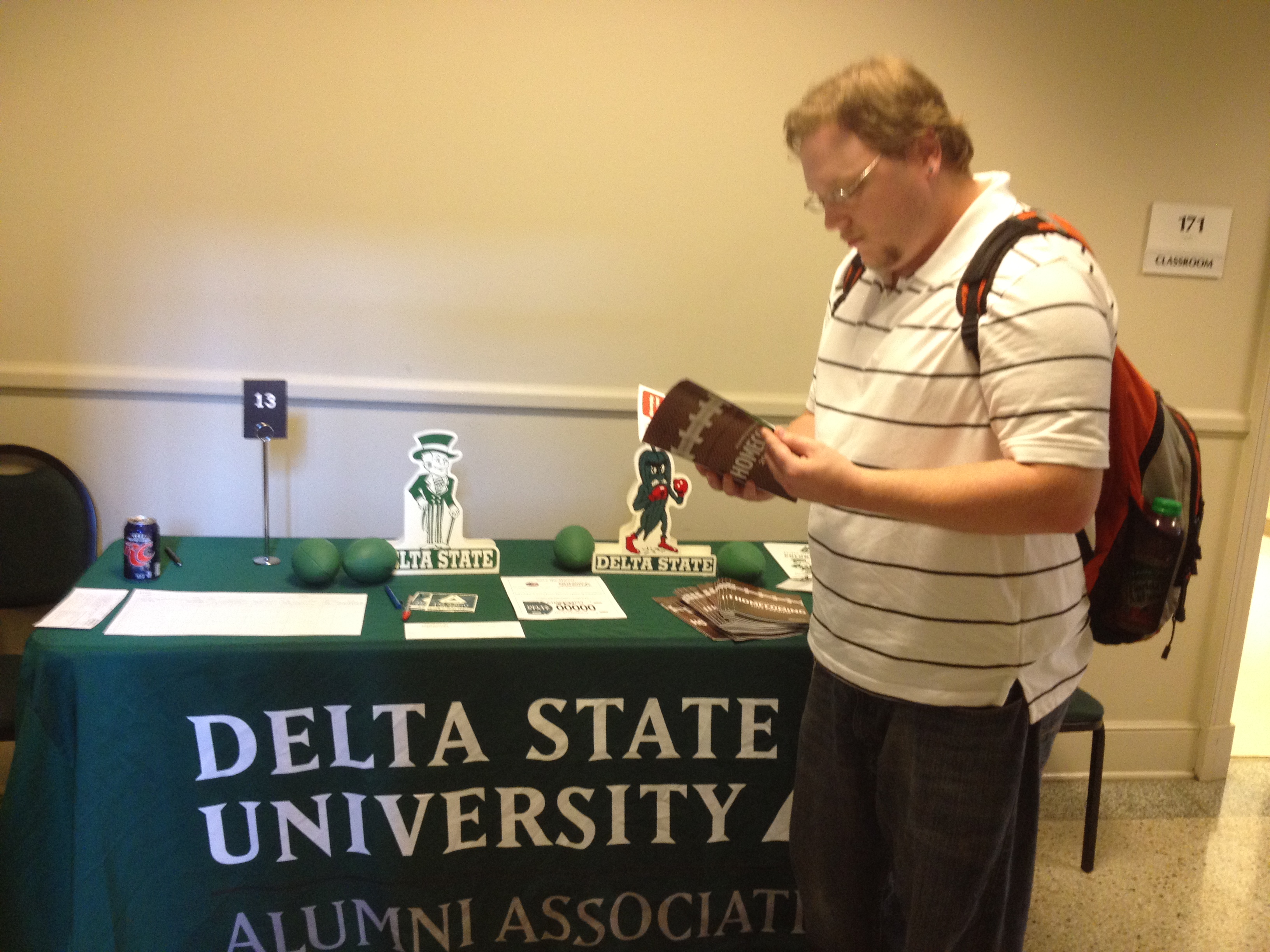 PHOTO:  Senior interdisciplinary studies major Jeremy Stevens, from Clarksdale, peruses the newest Alumni publication, the 2012 Homecoming Preview at the College of Business Career Fair.